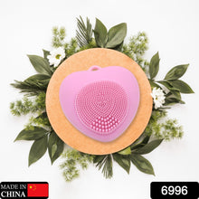 Silicone facial scrubber with heart shape, perfect for exfoliating skin